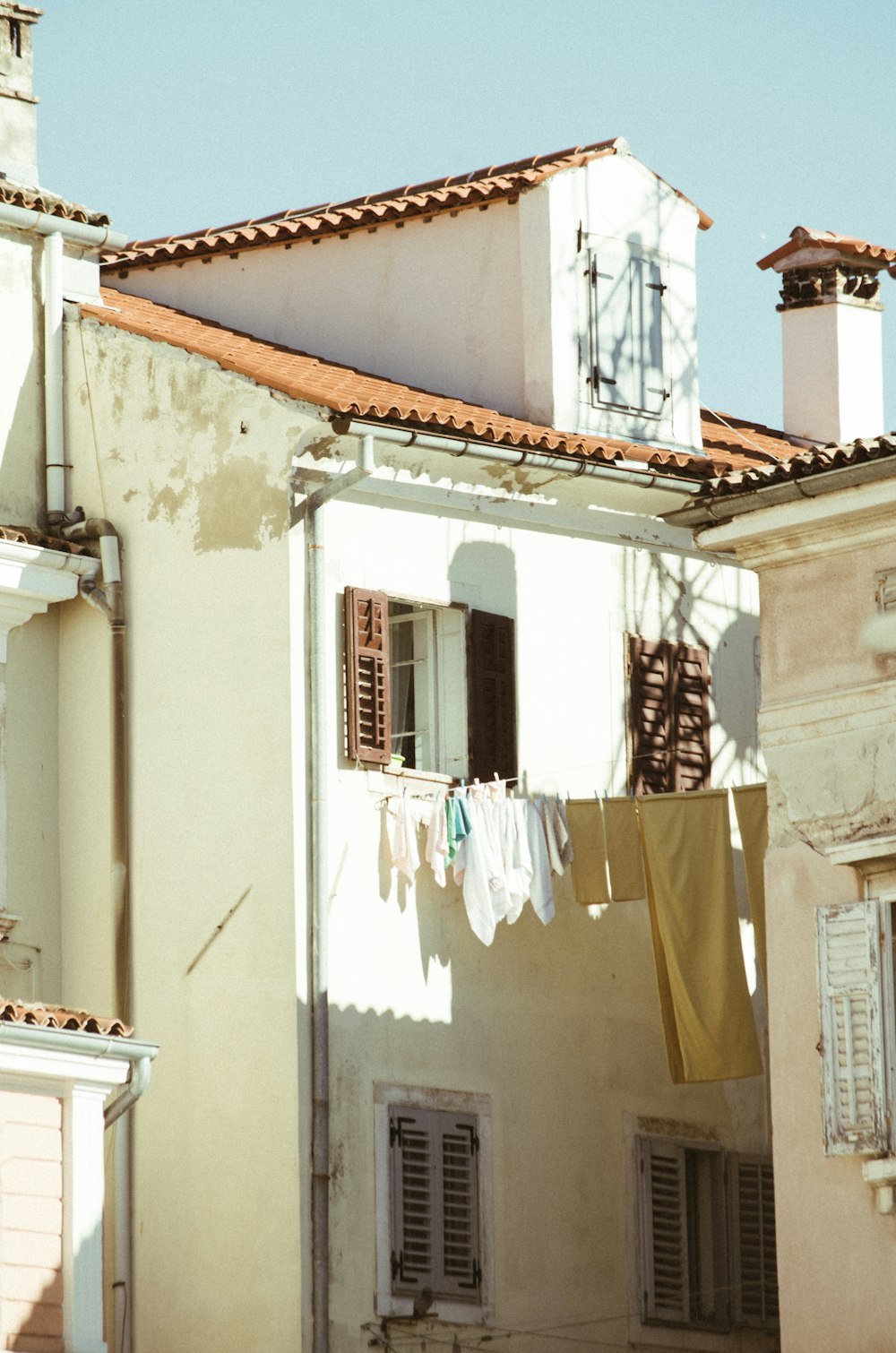 clothes hanging out to dry in front of a building