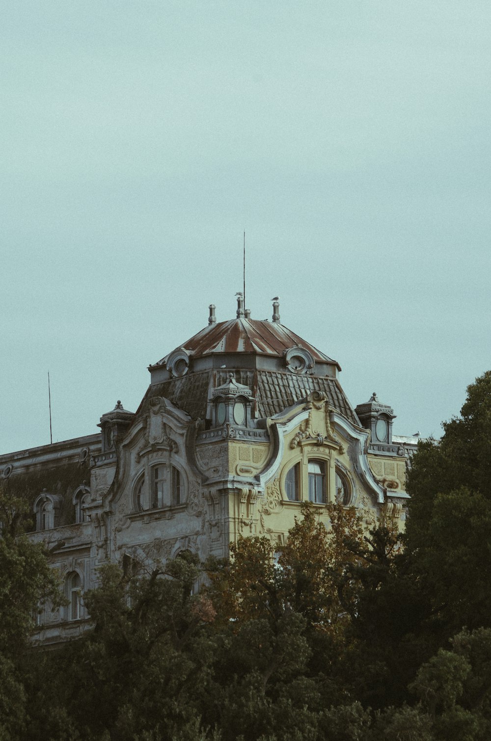 a tall building with a clock on the top of it