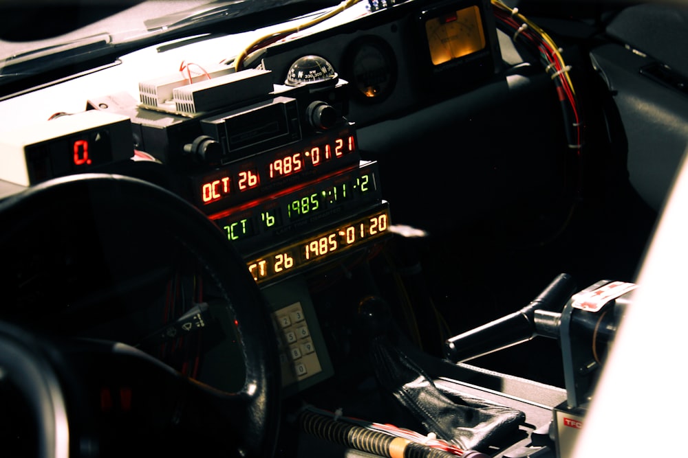 a car dashboard with a speedometer and other electronic devices