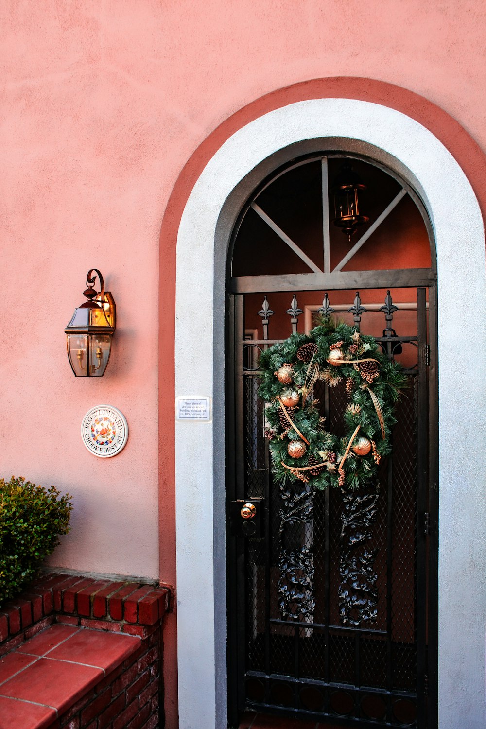 a door with a wreath hanging on it