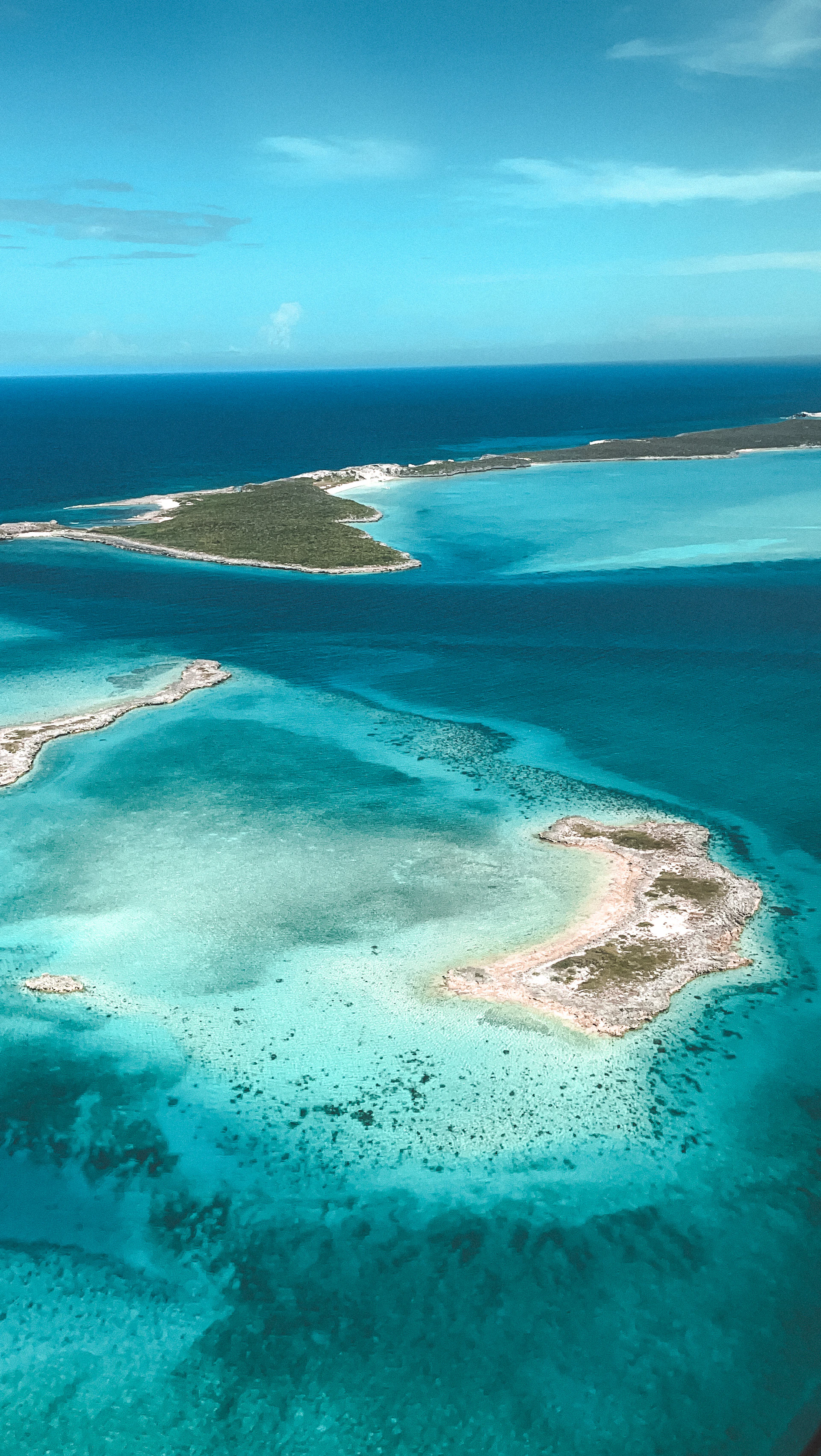 an aerial view of an island in the ocean