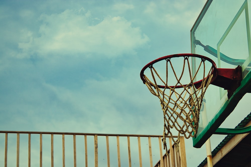 a basketball going through the net of a basketball court