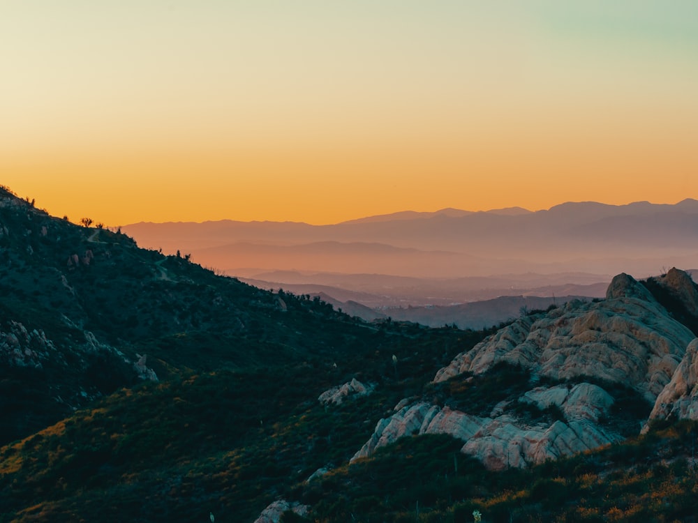 a view of a mountain range at sunset