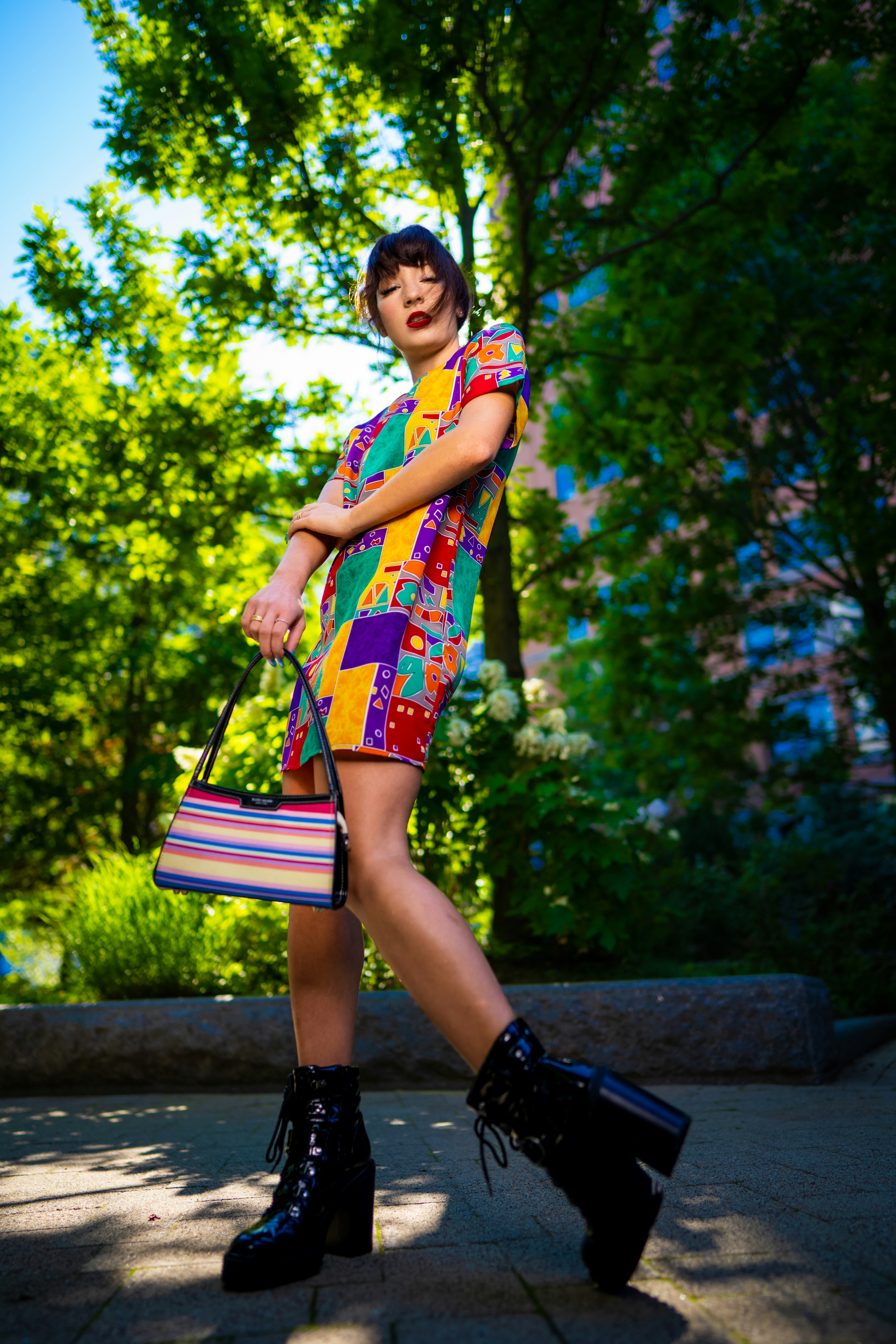 A woman in a colorful dress and black boots photo – Free Apparel Image ...