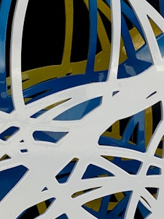 Original piece blending abstract forms with subtle automotive details in a minimalist palette.