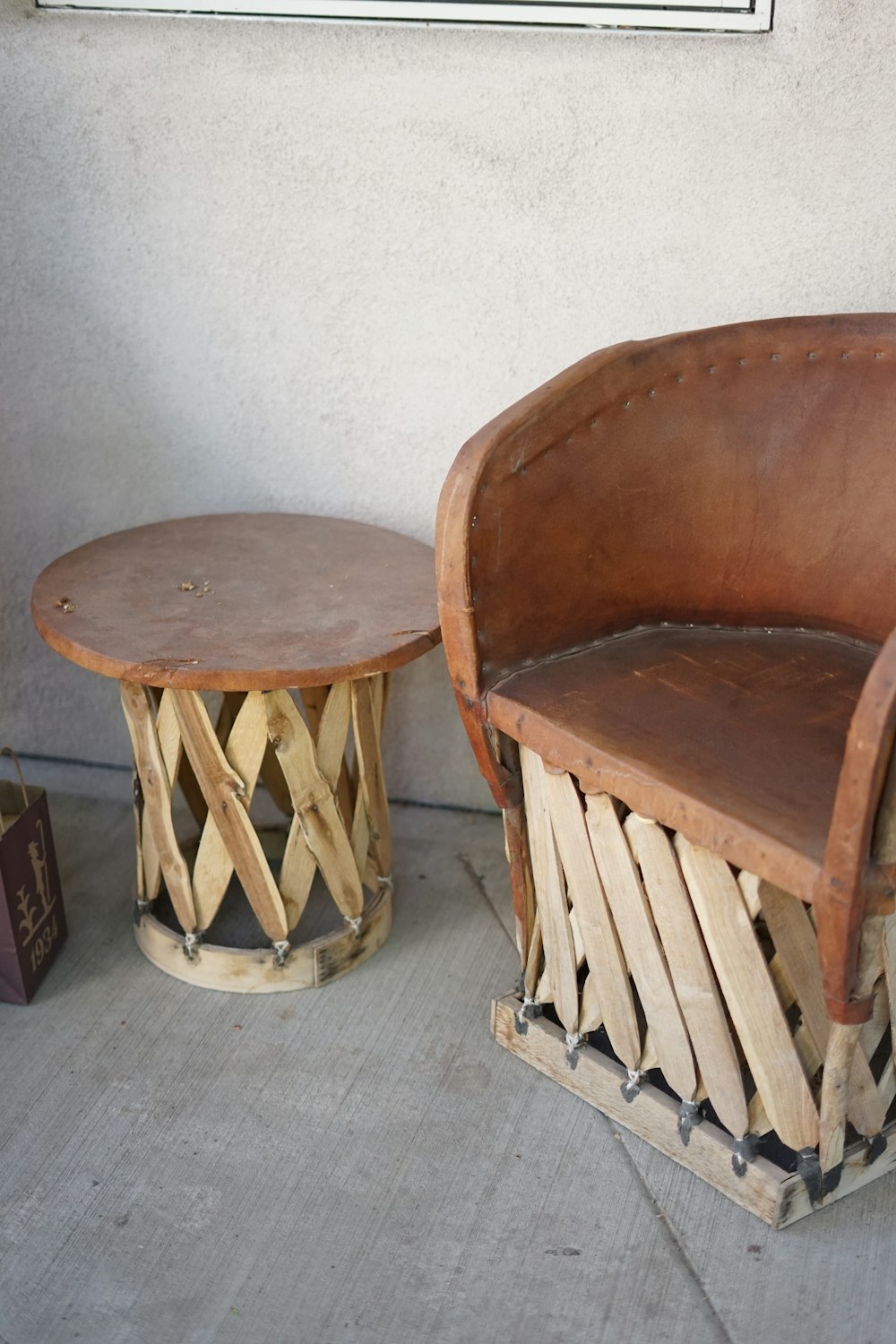 a couple of wooden chairs sitting next to each other