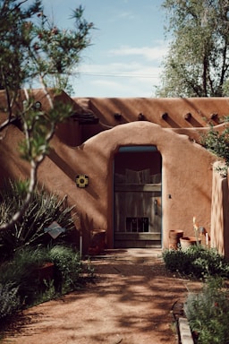 A welcoming office entrance of Desert Sierra Insurance Agency with warm lighting and desert landscape visible through the window.