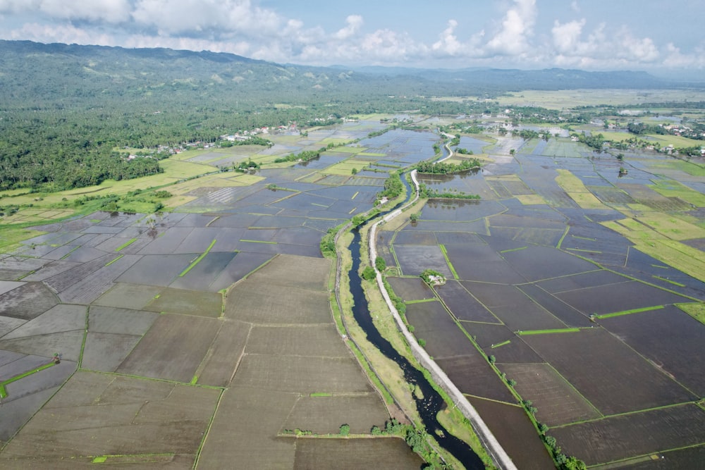 a river running through a lush green countryside