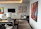 Modern living room wall decorated with elegant art pieces suggested by Fusinon Homes' AI system