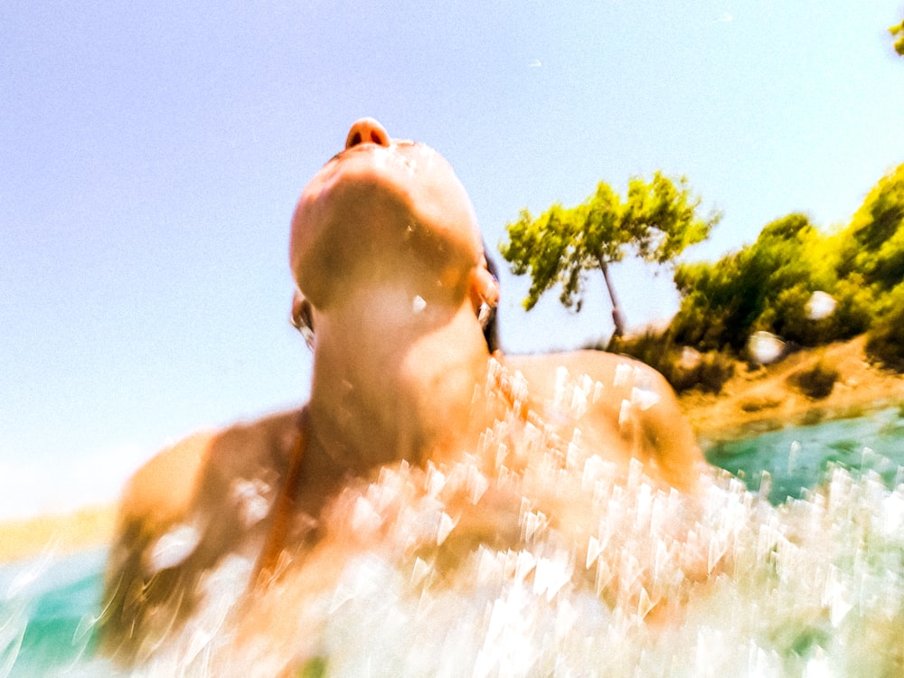 a man swimming in a body of water