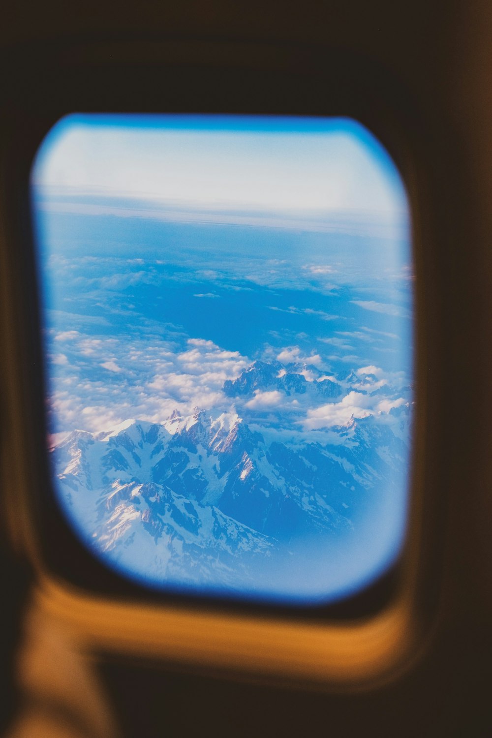 a view of the mountains from an airplane window