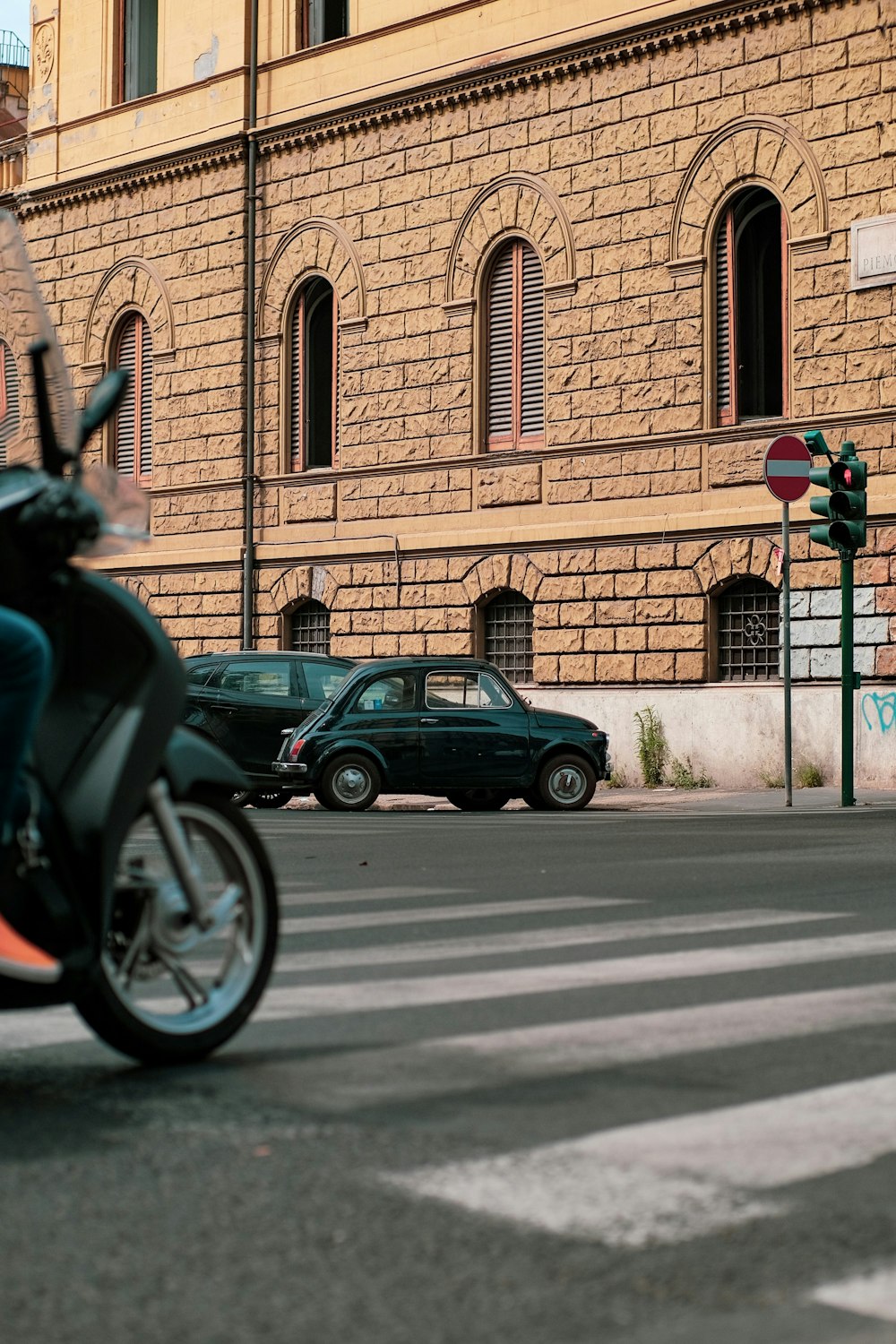 a person riding a motorcycle on a city street