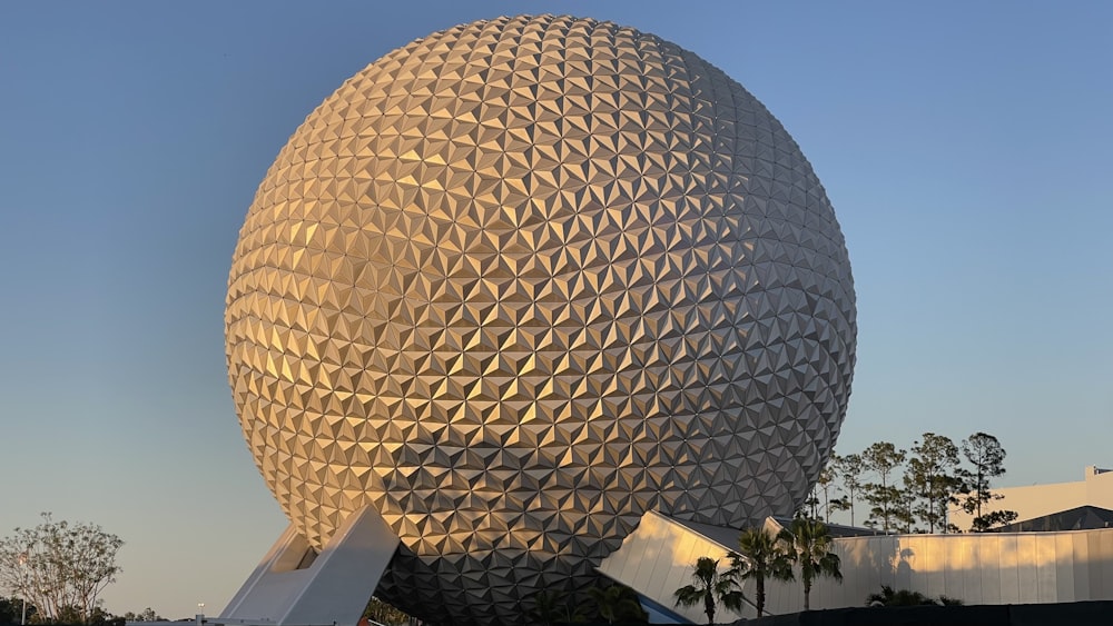 a large building with a giant ball on top of it