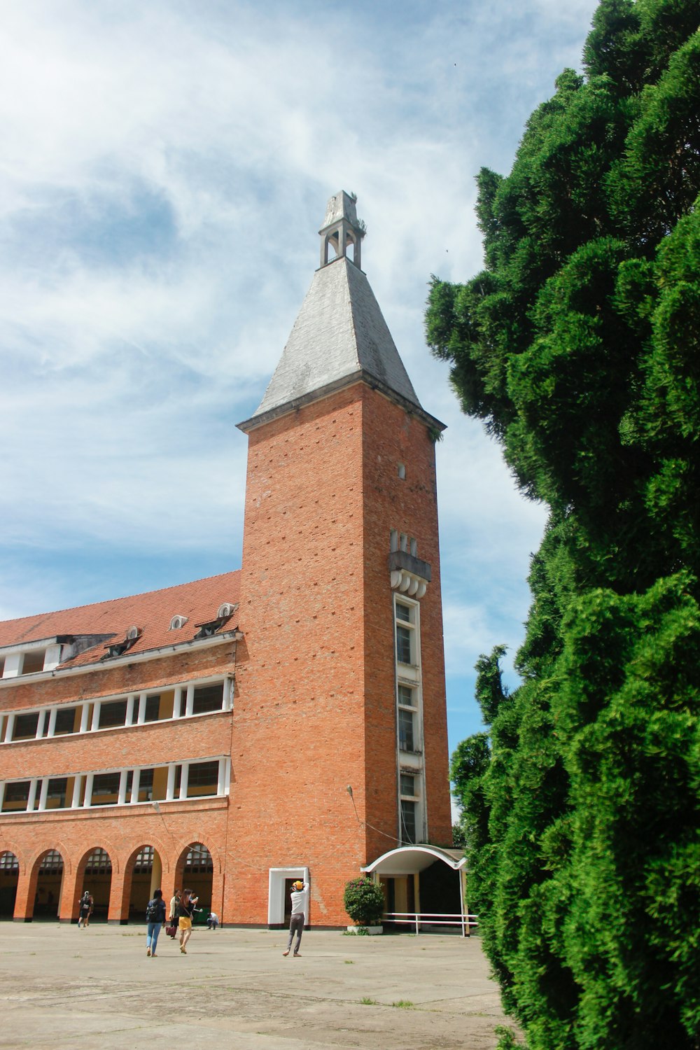 a tall brick building with a clock tower