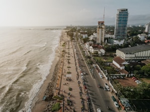 an aerial view of a beach and a city