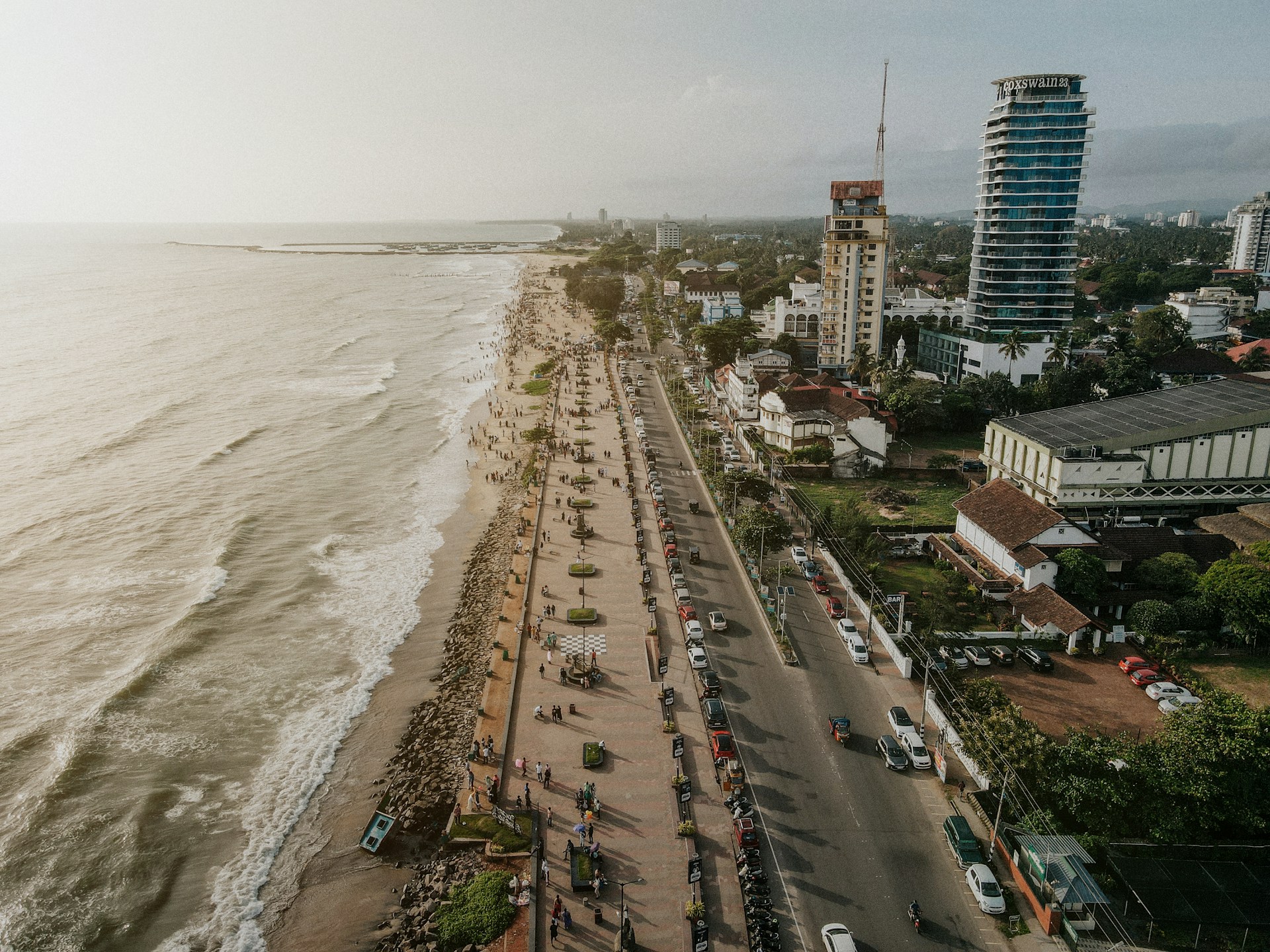 an aerial view of a beach and a city
