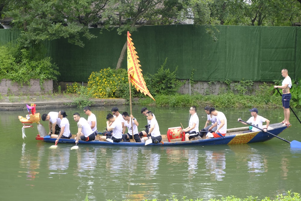 a group of people riding on the back of a boat