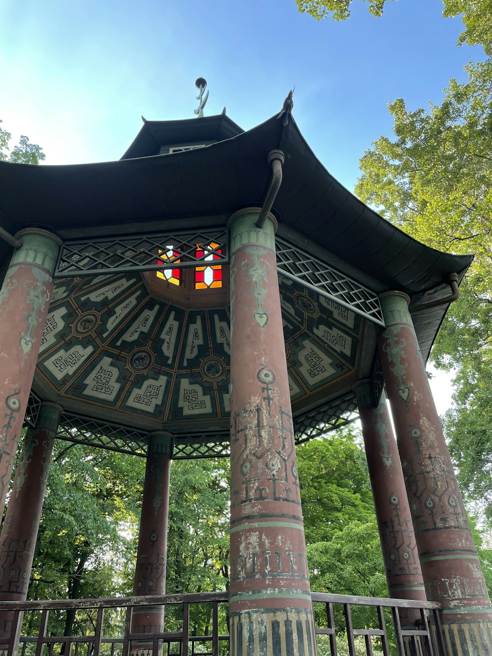 a clock tower in the middle of a park