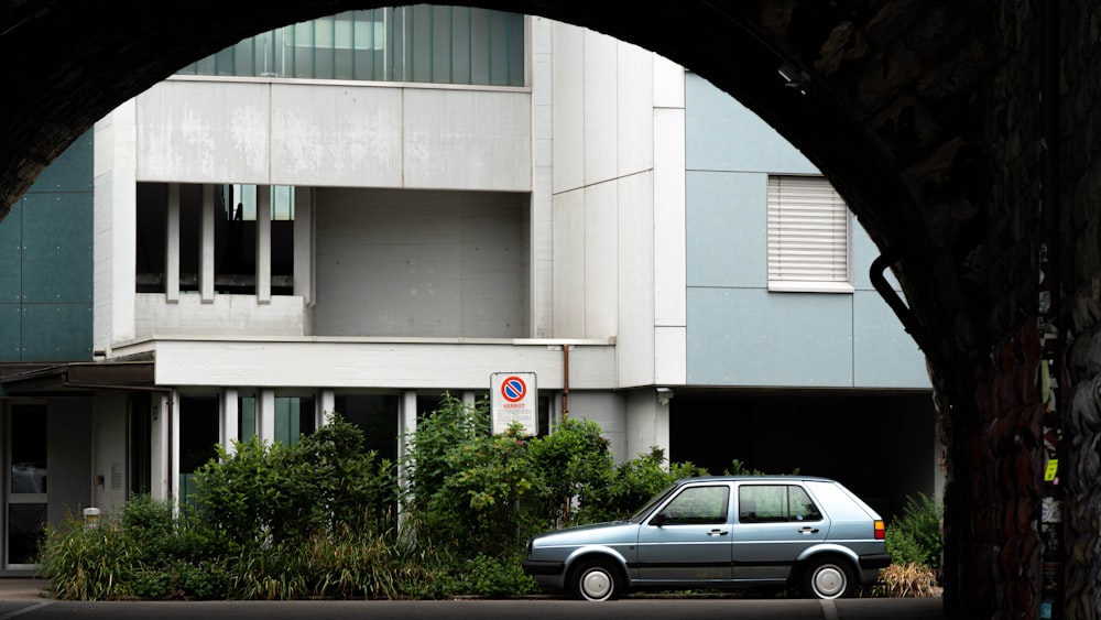 a car is parked in front of a building