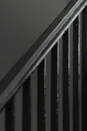 Close-up of sturdy metal handrails installed on a staircase.