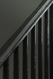 Close-up of sturdy metal handrails installed on a staircase.