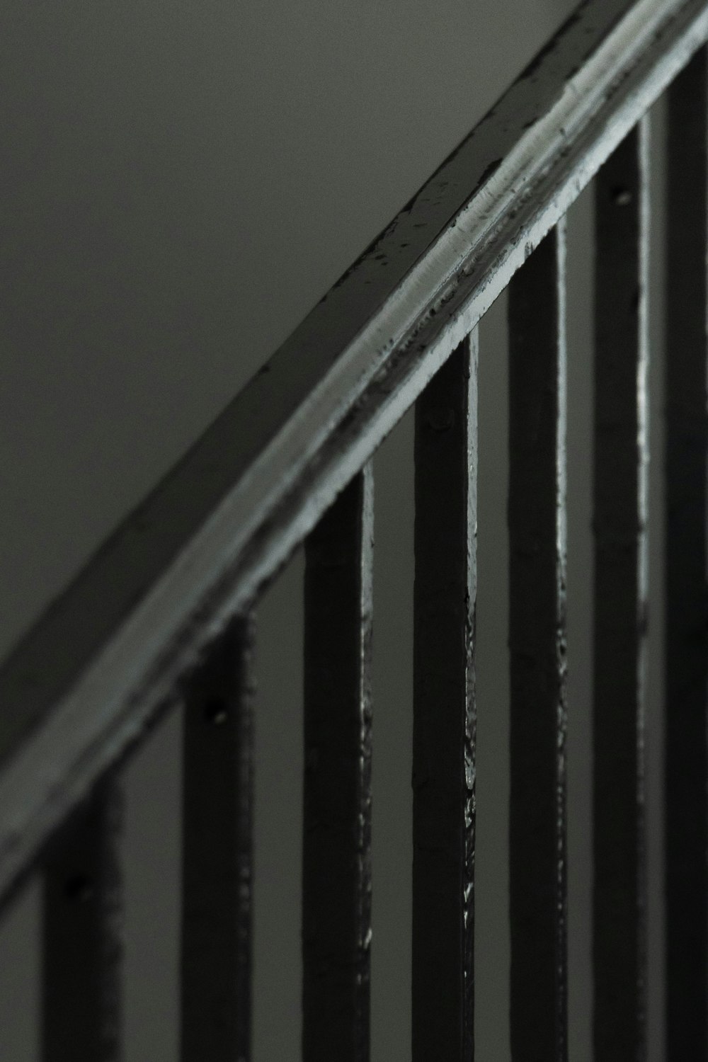 a black and white photo of a hand rail