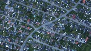 A bird's-eye view of a suburban neighborhood with homes.
