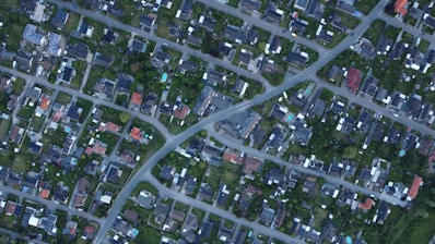 An aerial view of a suburban neighborhood with houses.