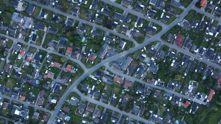 A bird's-eye view of a suburban neighborhood with homes.