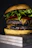Close-up of a juicy Rokko Burger with melted cheddar and fresh lettuce on a black slate background.