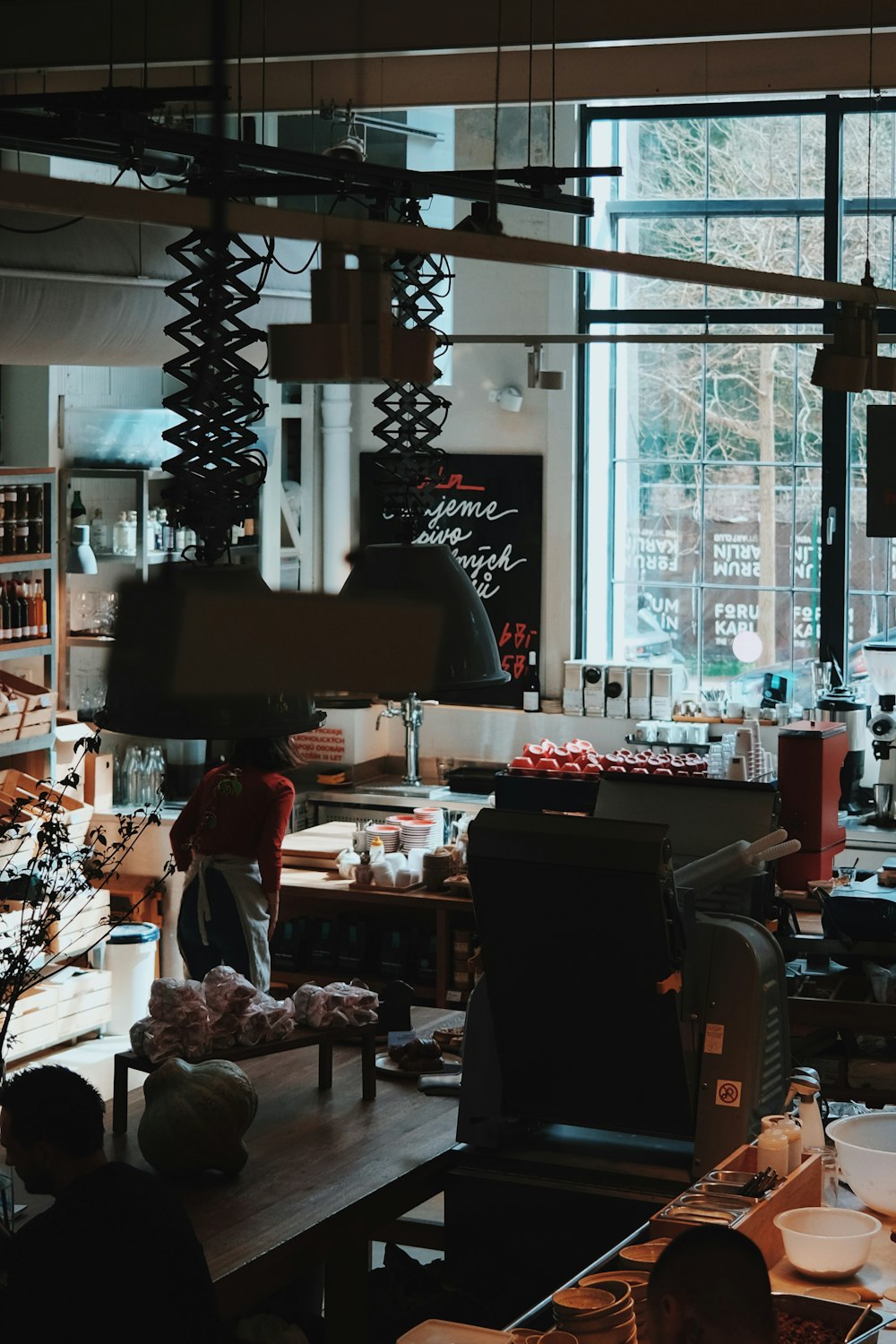 a restaurant with a lot of food on the counter