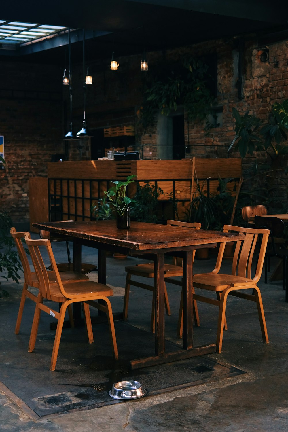 a wooden table with four chairs around it