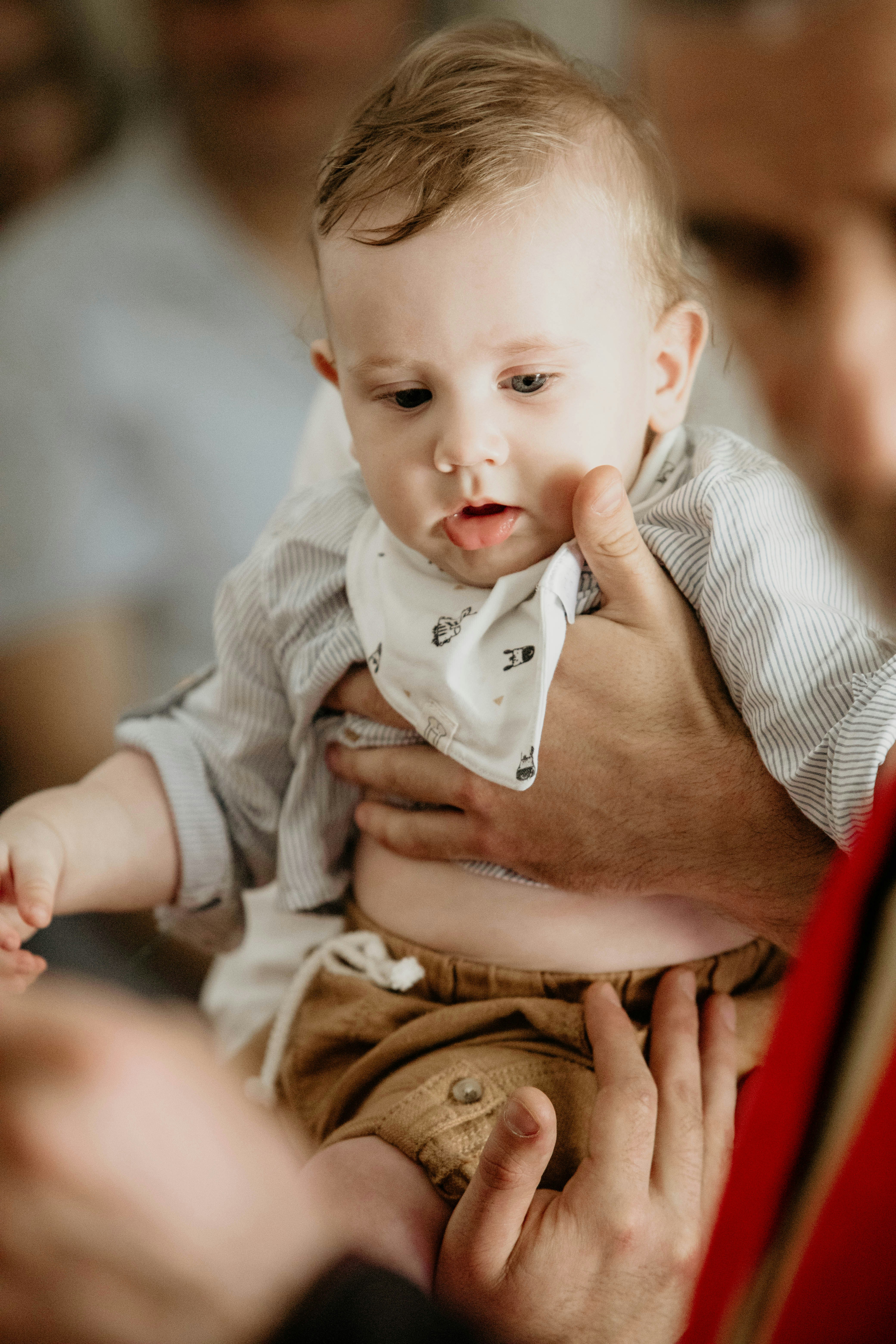 a man holding a baby in his lap