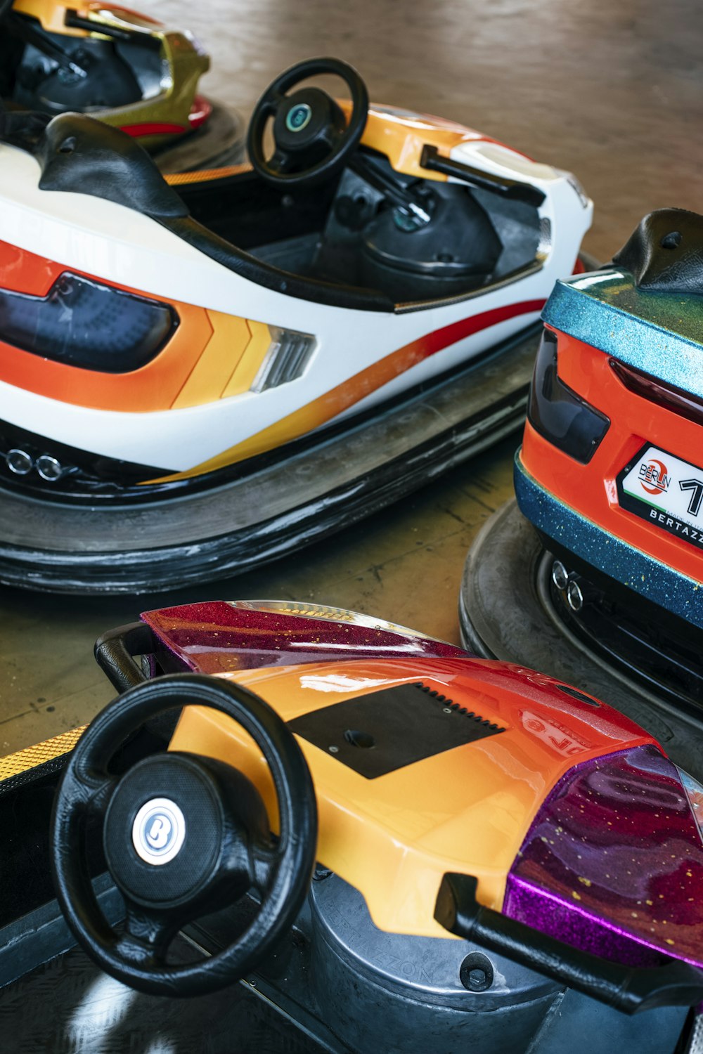 a couple of bumper cars sitting on top of a wooden table