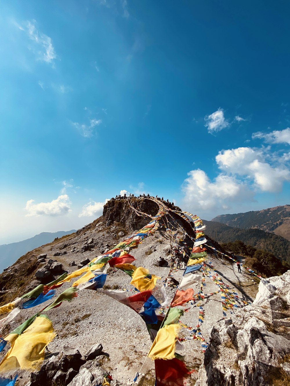 a mountain top with a lot of flags on it