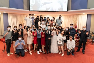 A diverse group of delegates casting their votes in a formal convention hall.