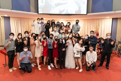 A diverse group of delegates casting their votes in a formal convention hall.