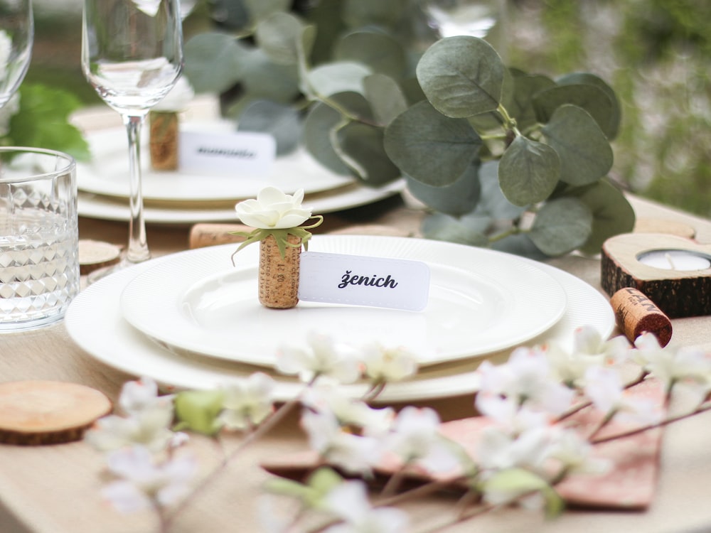 a place setting with place cards and place settings