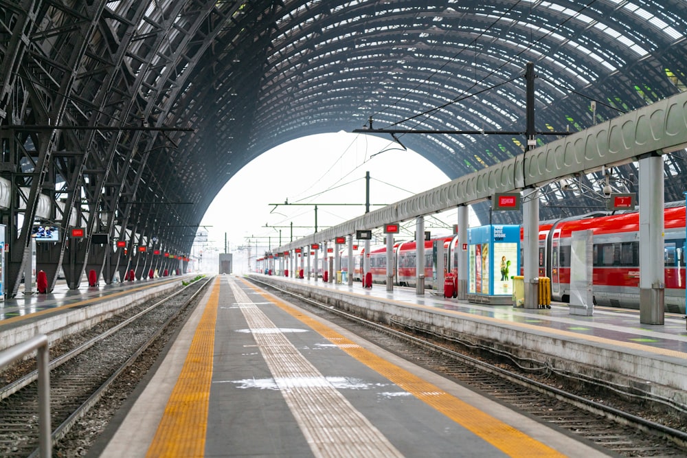 a train station with a train on the tracks