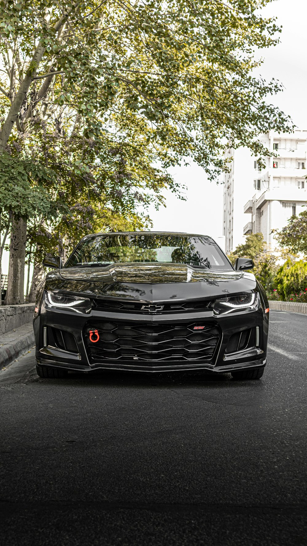 a black sports car parked on the side of the road