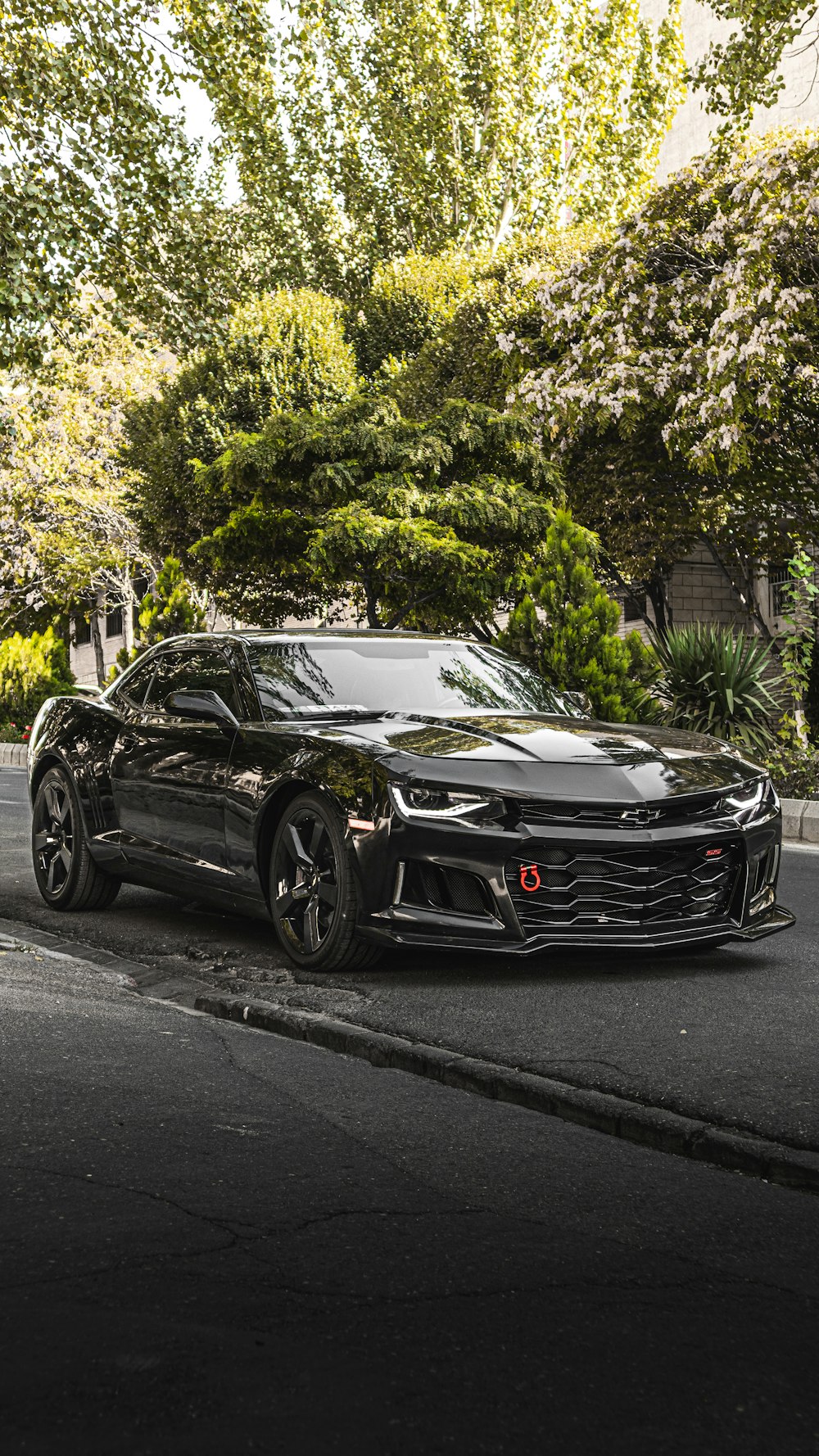 a black sports car parked on the side of the road