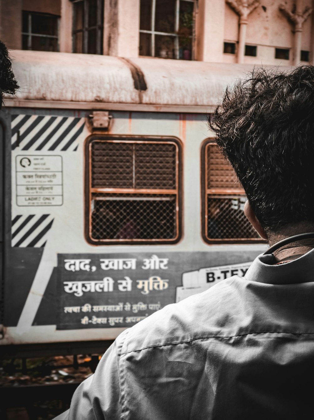 a man standing in front of a train