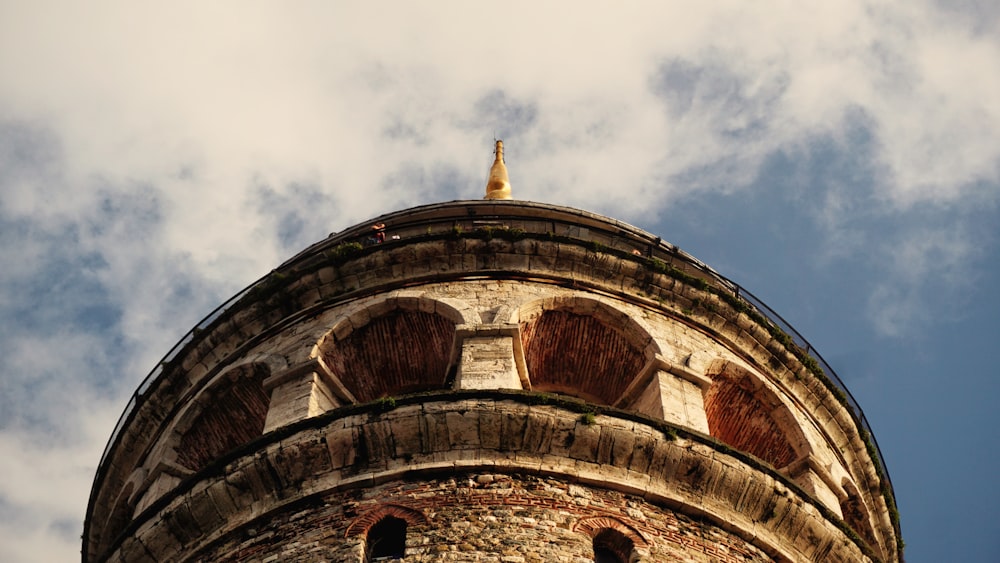 a very tall tower with a sky in the background