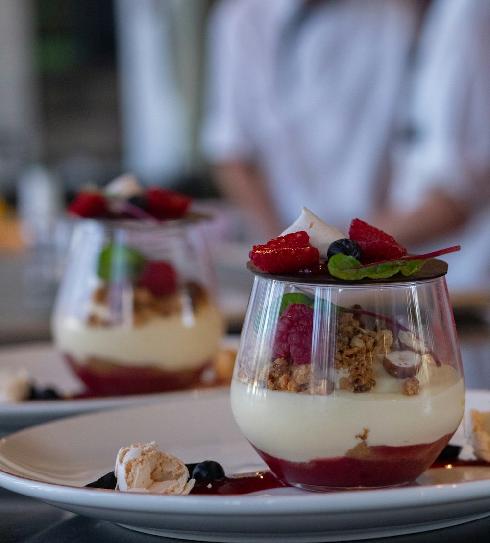 a dessert with fruit and cream on a plate