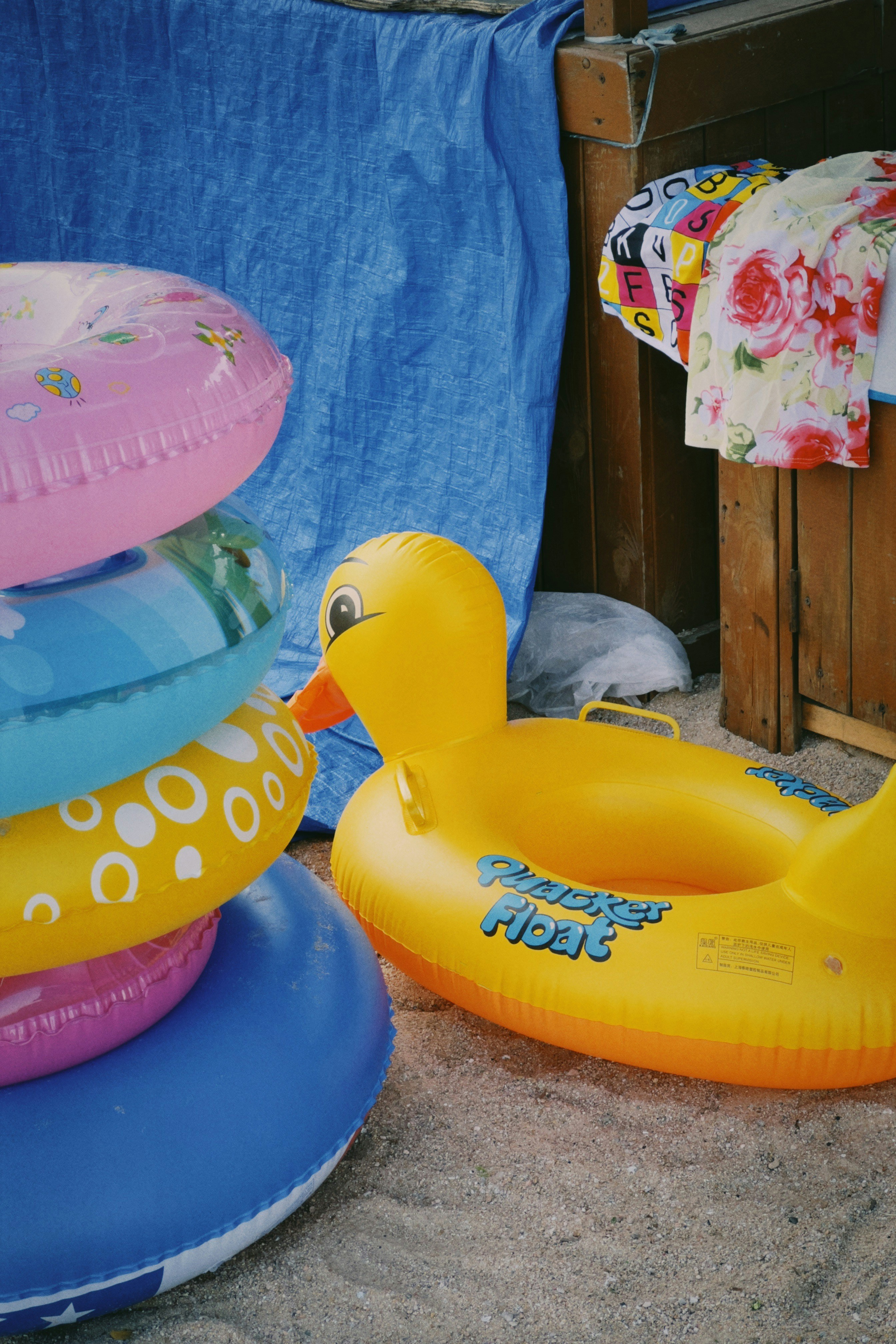 A bunch of inflatable toys sitting on the ground photo – Free ...