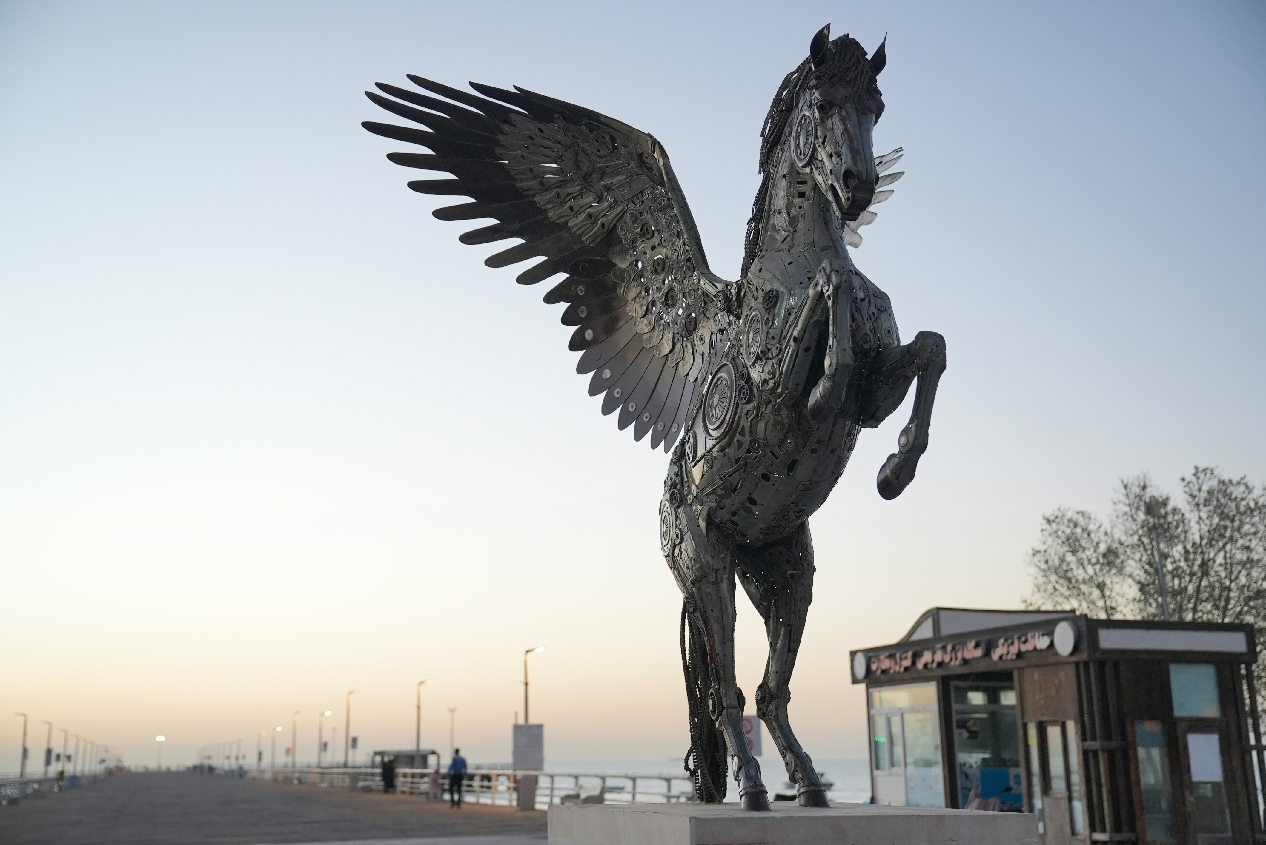 a statue of a horse with its wings spread
