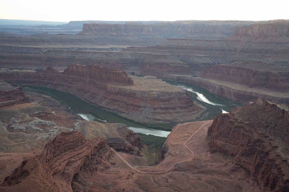 a river running through a canyon surrounded by mountains