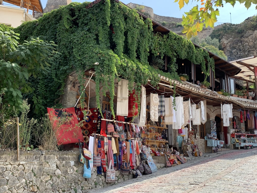 a row of shops on a cobblestone street