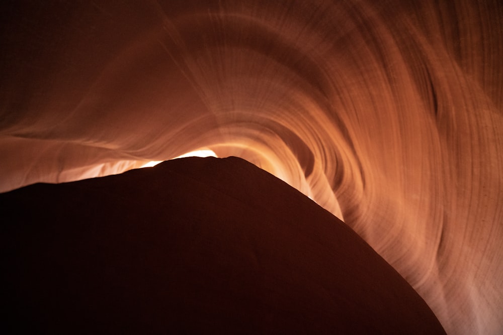 a large rock formation with a sky in the background