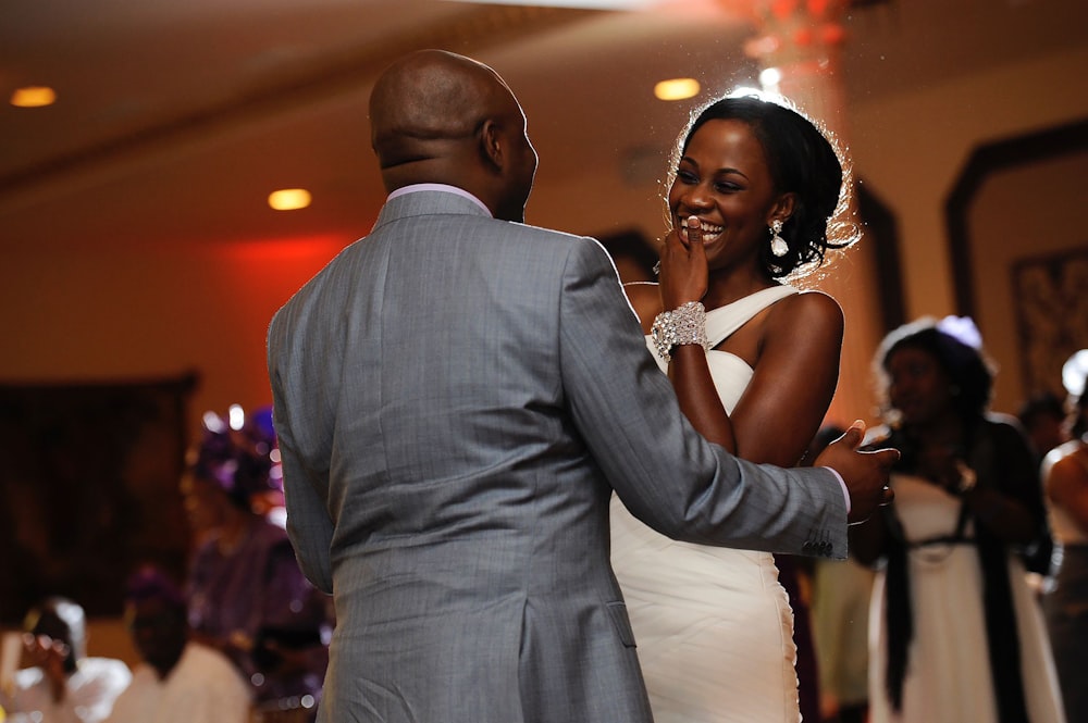 a bride and groom dancing at a wedding reception